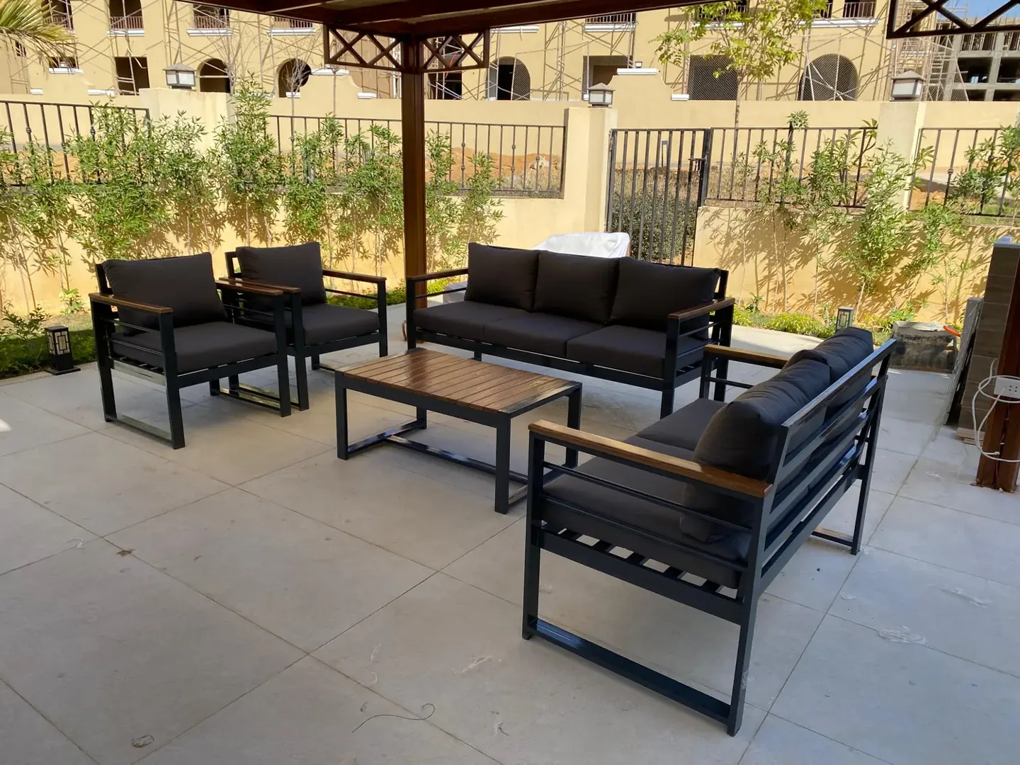 Metal and wood set with black cushions from a real Nestica delivery in 6th of October
